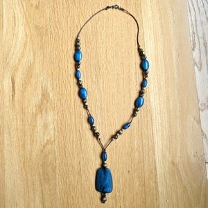 Beautiful blue beaded necklace on cord.